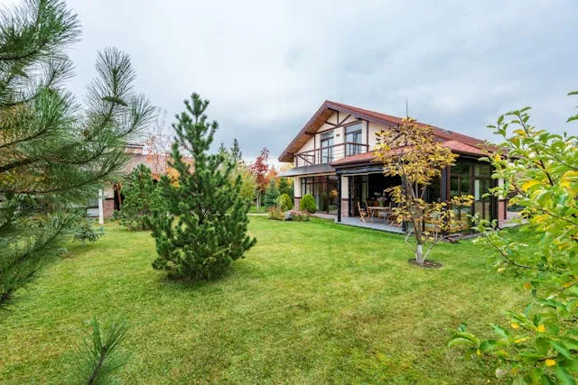backyard of a nice house with trees